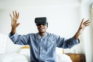 A man experiencing VR in bed